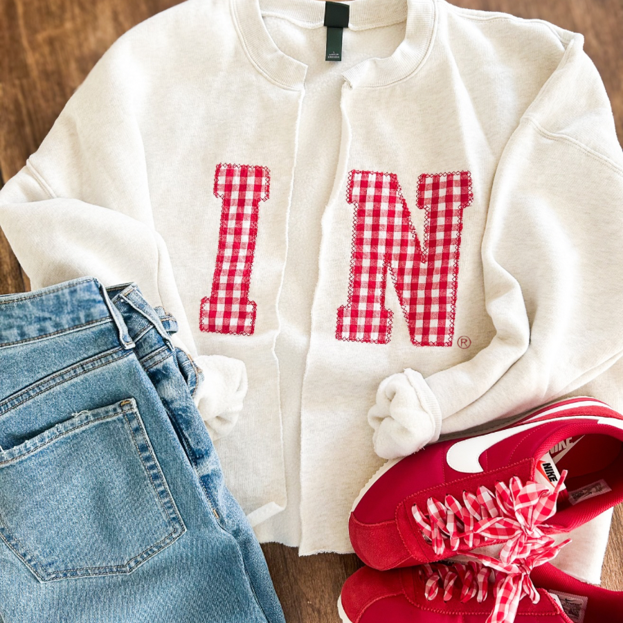 Cream sweatshirt with IN in gingham applique, cut down the middle to become a cardigan style sweatshirt